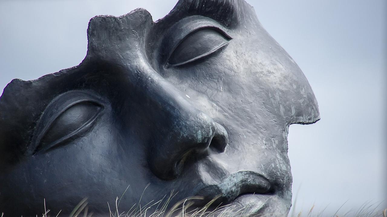 A partial face carved from stone