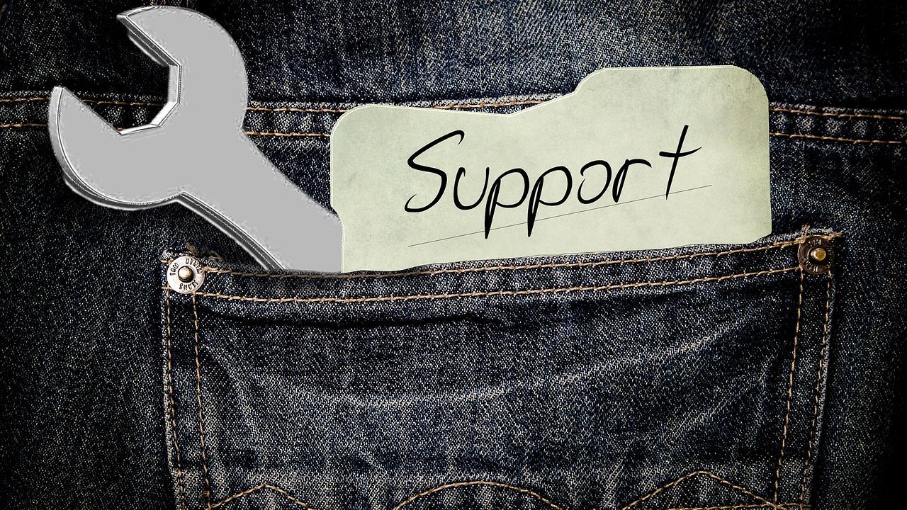 Support caption with a wrench in the back pocket of a pair of jeans