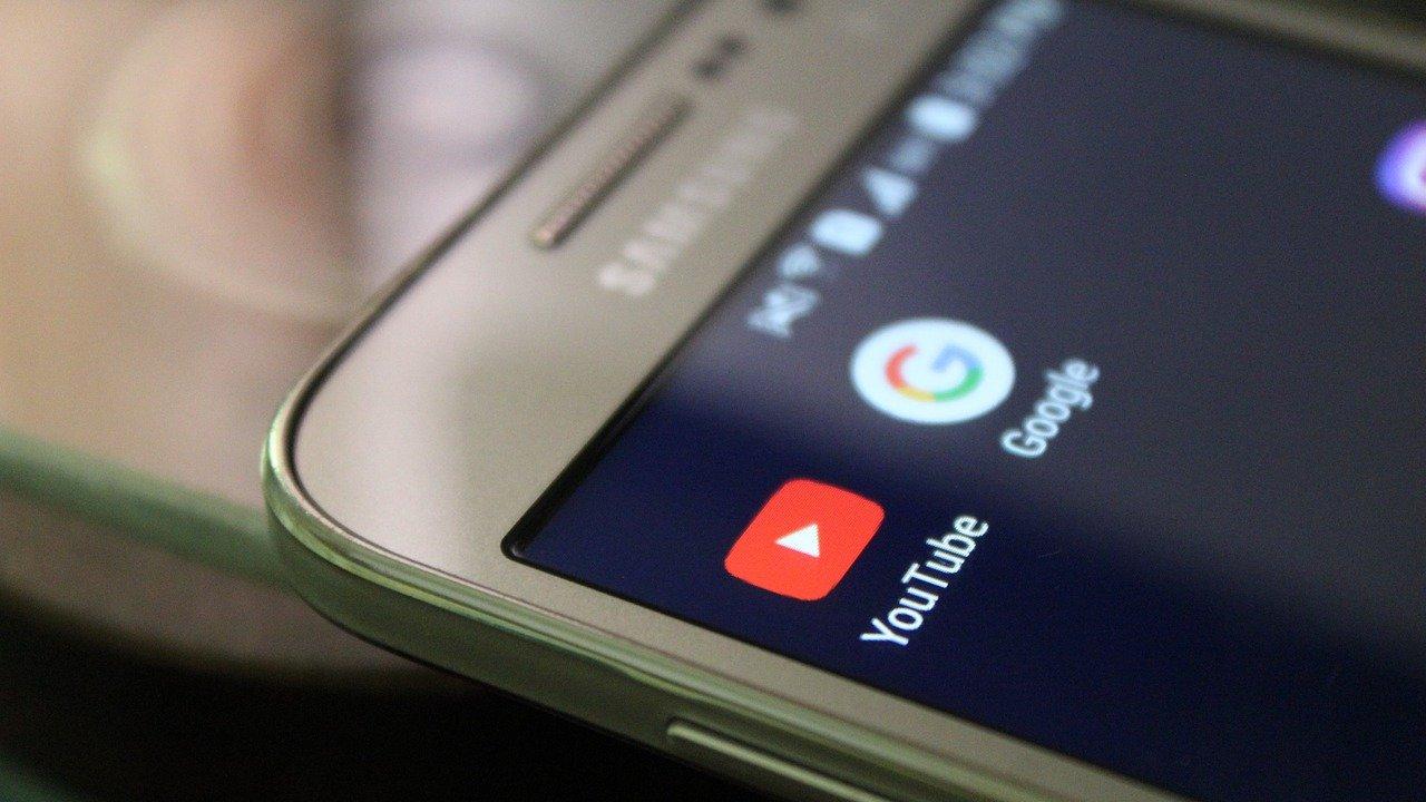 A close-up view of a screen with the YouTube and Google logo icons. By Irfan Ahmad from Pixabay.