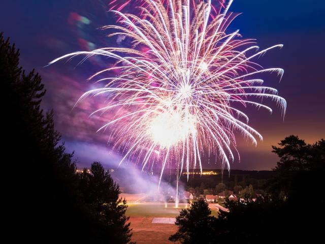 Celebratory fireworks over a field