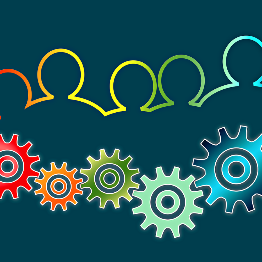 Colorful outlines of human figures above interlocking gears on a teal background.