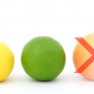 A small lemon, a medium sized lime, and a large orange, with the orange crossed out with an X indicating it is too large.