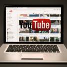 A YouTube channel page displayed on a laptop screen.