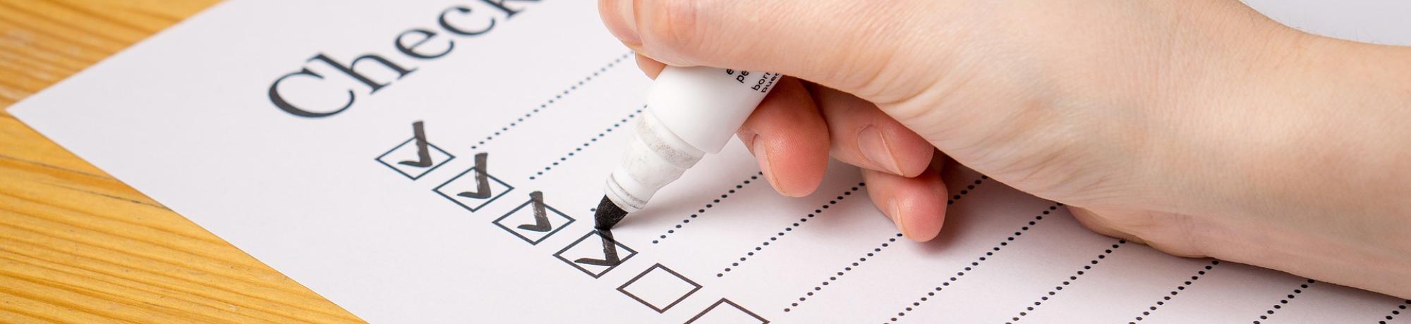 Person in the process of going through a checklist
